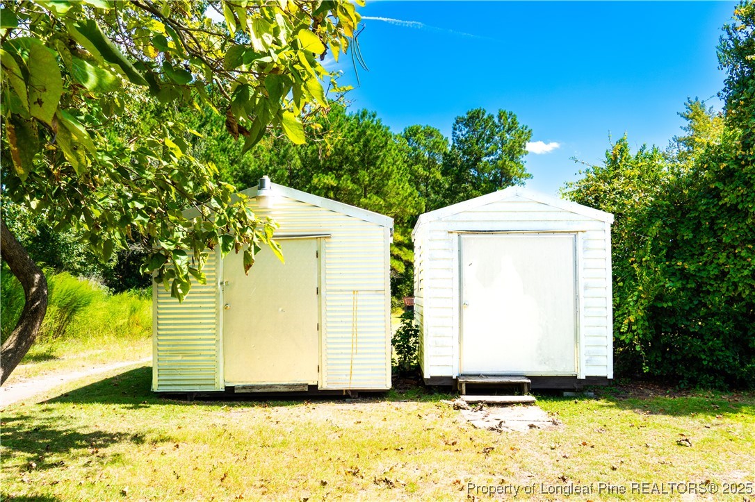 666 Jacobs Road Maxton, NC 28364 - Photo 30 of 30 a view of a house with a yard