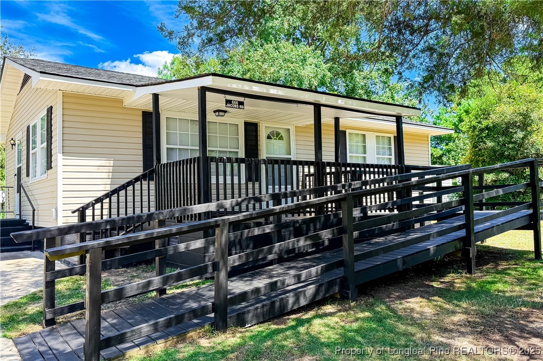 666 Jacobs Road Maxton, NC 28364 - Photo 3 of 30 a view of a house with wooden deck