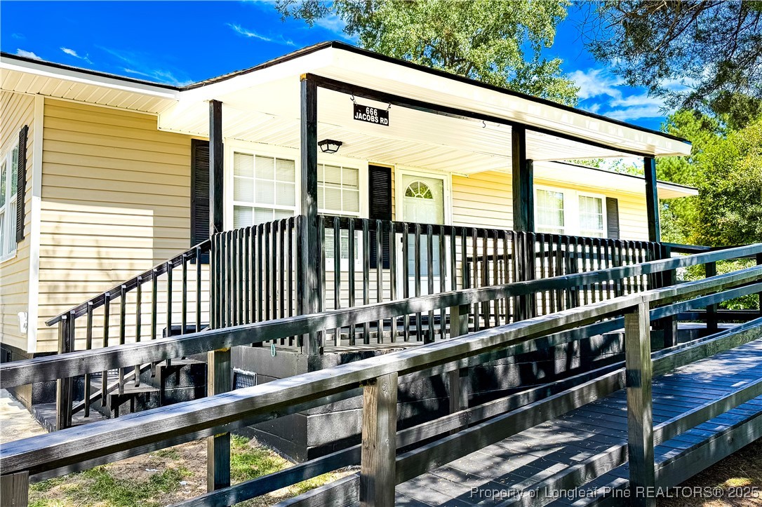 666 Jacobs Road Maxton, NC 28364 - Photo 4 of 30 a view of a balcony with a large window