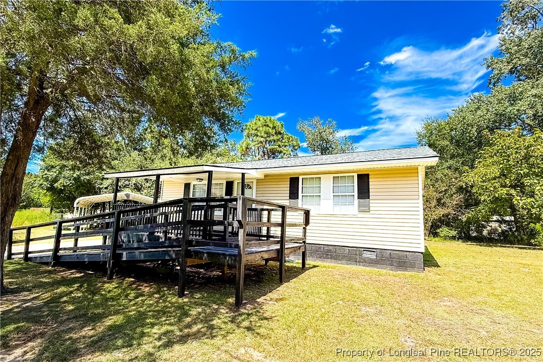666 Jacobs Road Maxton, NC 28364 - Photo 6 of 30 a view of a house with a yard