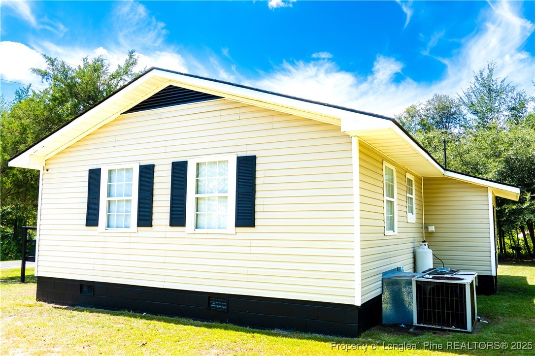 666 Jacobs Road Maxton, NC 28364 - Photo 8 of 30 a view of a house with a yard