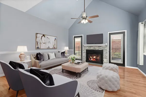 a living room with furniture and a fireplace