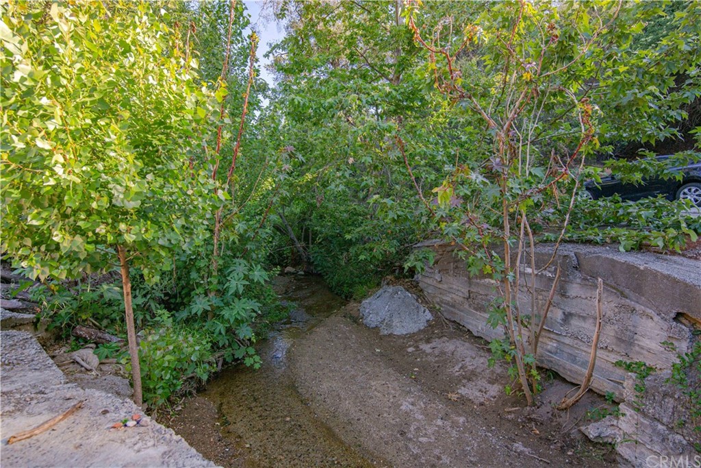 20000000 West Mission Road Fallbrook, CA 92028 - Photo 1 of 1 a backyard of a house with lots of trees
