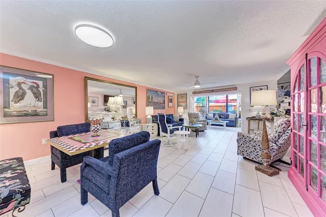 a living room with furniture and white walls