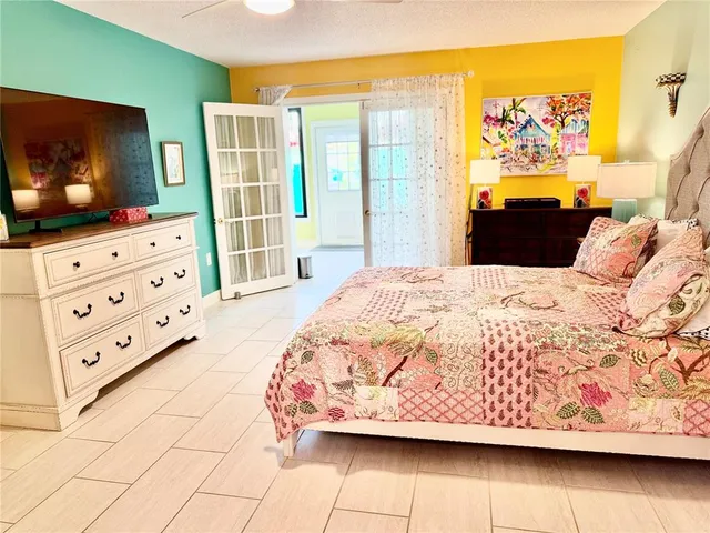 a bathroom with a sink a toilet a mirror a vanity and shower