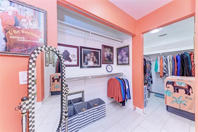 a view of a chairs and table under an umbrella in the garden