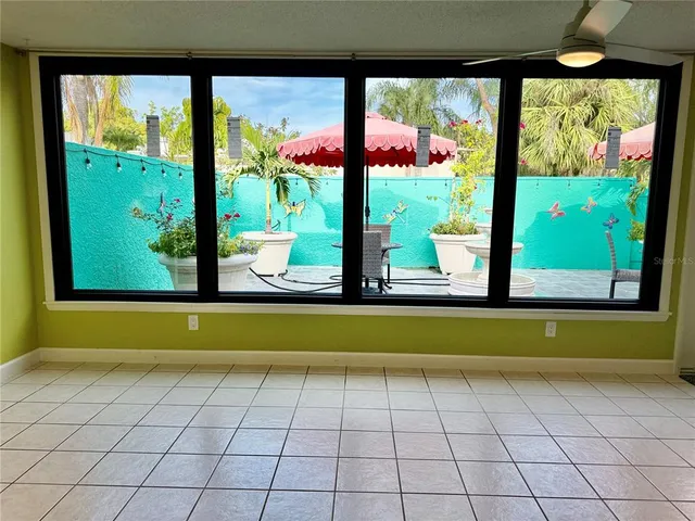a view of a patio with furniture and a yard