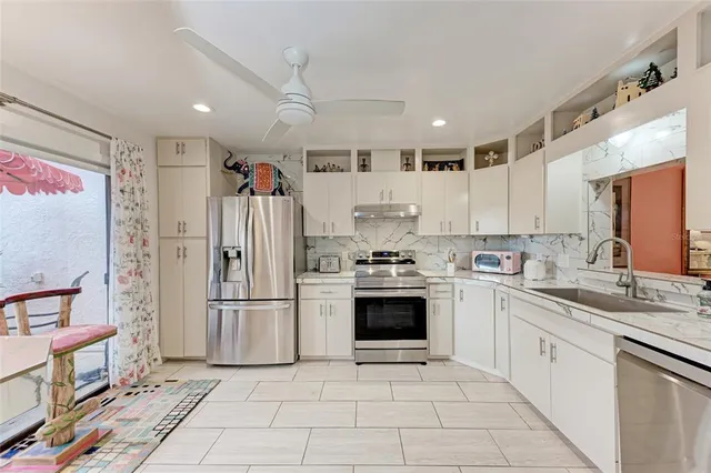 a kitchen with a refrigerator a sink and dishwasher