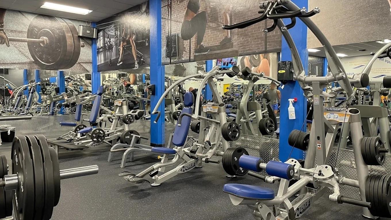 16200 Golf Club Road, Unit 312 Weston, FL 33326 - Photo 25 of 31 a view of a room with gym equipment