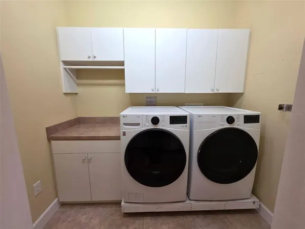 a utility room with dryer and washer
