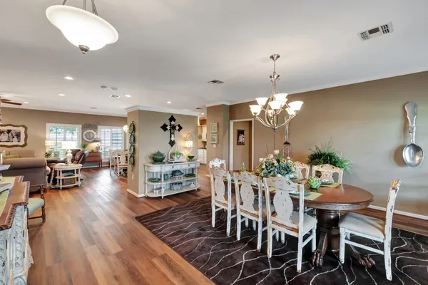 a view of a dining room with furniture window and wooden floor