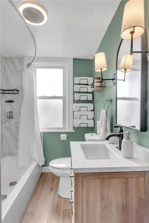 a bathroom with a sink a toilet and a bathtub