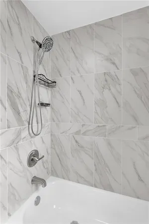 a bathroom with a bath tub
