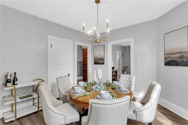 a dining room with furniture and window