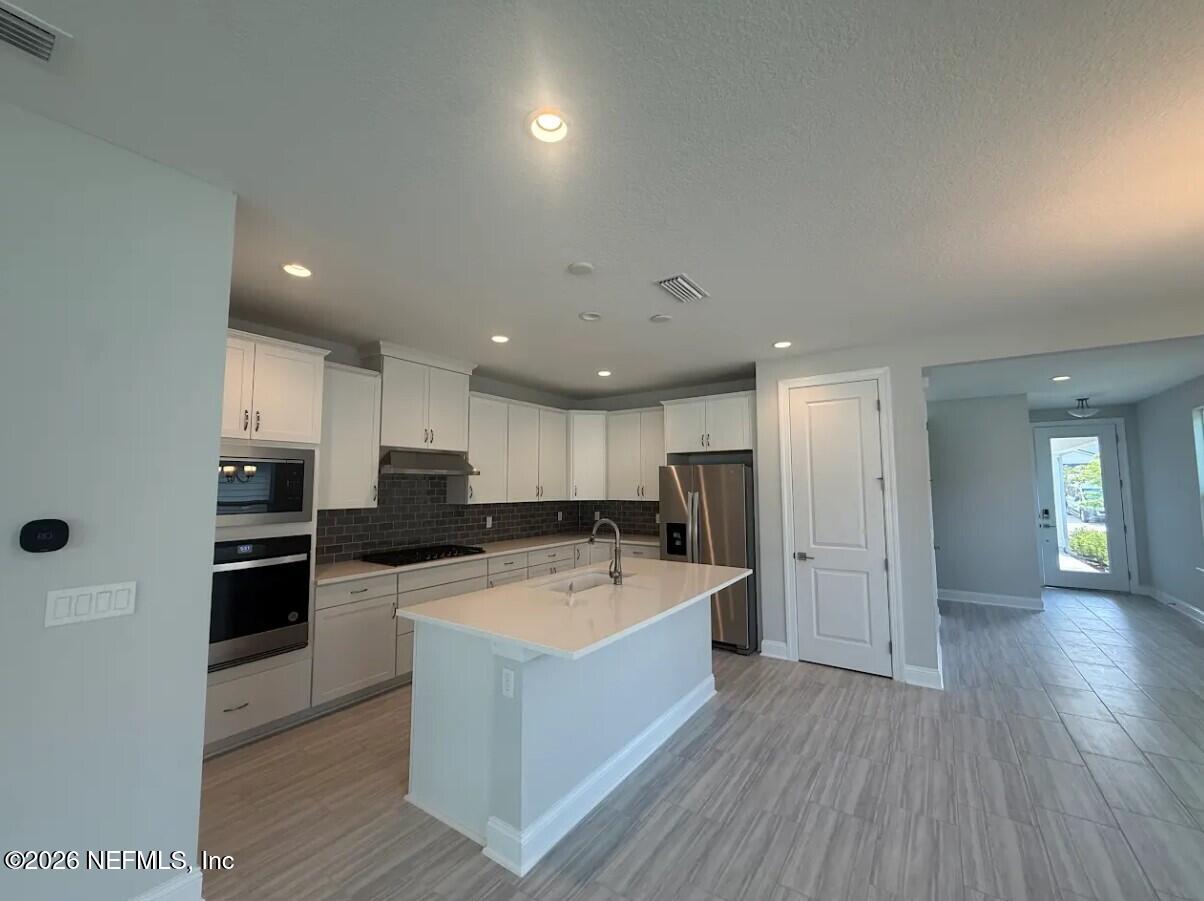 15 Mulberry Road Palm Coast, FL 32164 - Photo 7 of 22 Kitchen to Entry view