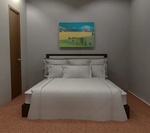 a bedroom with a bed and a painting on the wall