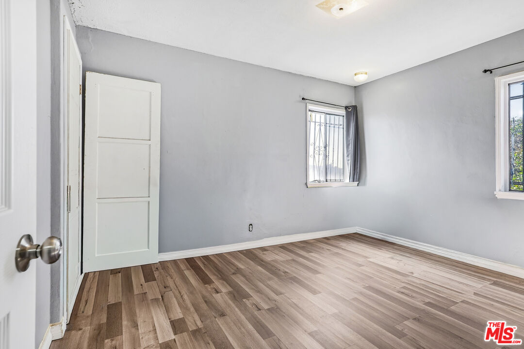 1969 Heidleman Road Los Angeles, CA 90032 - Photo 12 of 18 an empty room with a hardwood and wooden floor