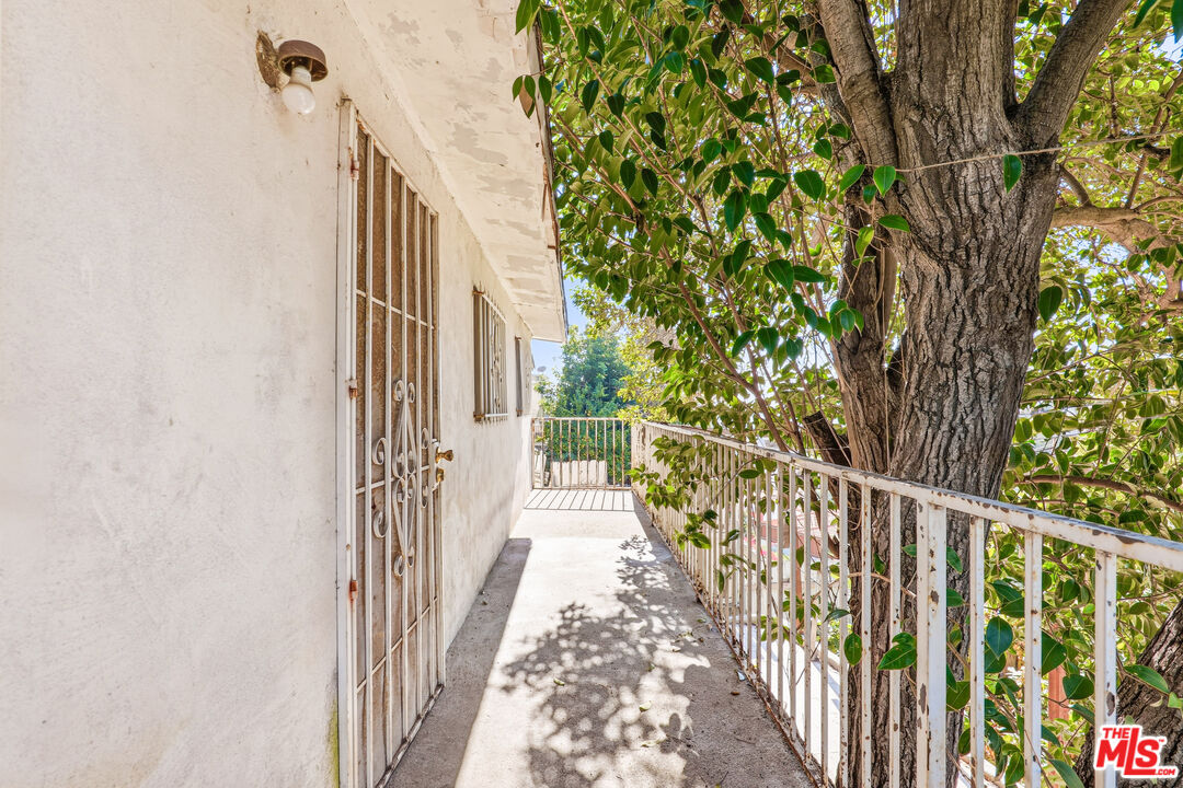 1969 Heidleman Road Los Angeles, CA 90032 - Photo 15 of 18 a view of a pathway of a house with wooden fence