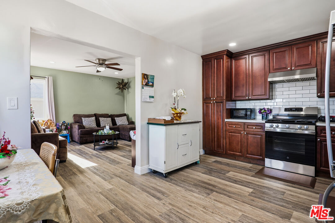 1969 Heidleman Road Los Angeles, CA 90032 - Photo 6 of 18 a kitchen with sink cabinets and wooden floor