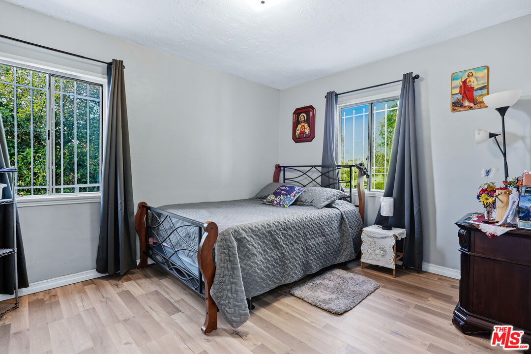 1969 Heidleman Road Los Angeles, CA 90032 - Photo 8 of 18 a bedroom with a bed and a window