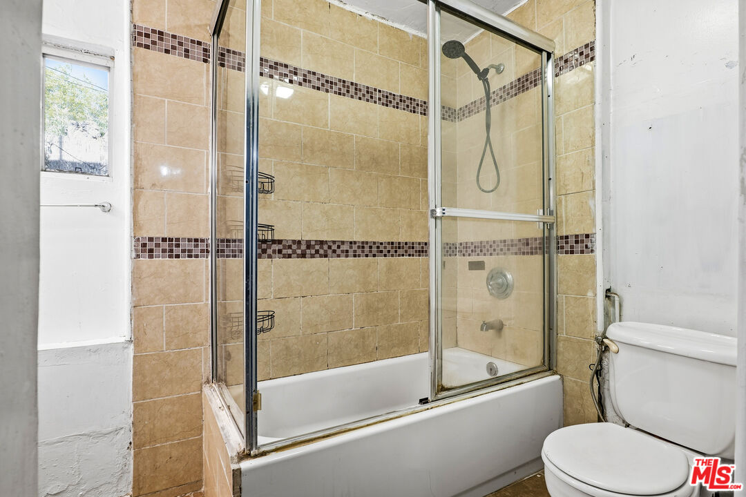 1969 Heidleman Road Los Angeles, CA 90032 - Photo 10 of 18 a bathroom with a shower and a glass door shower