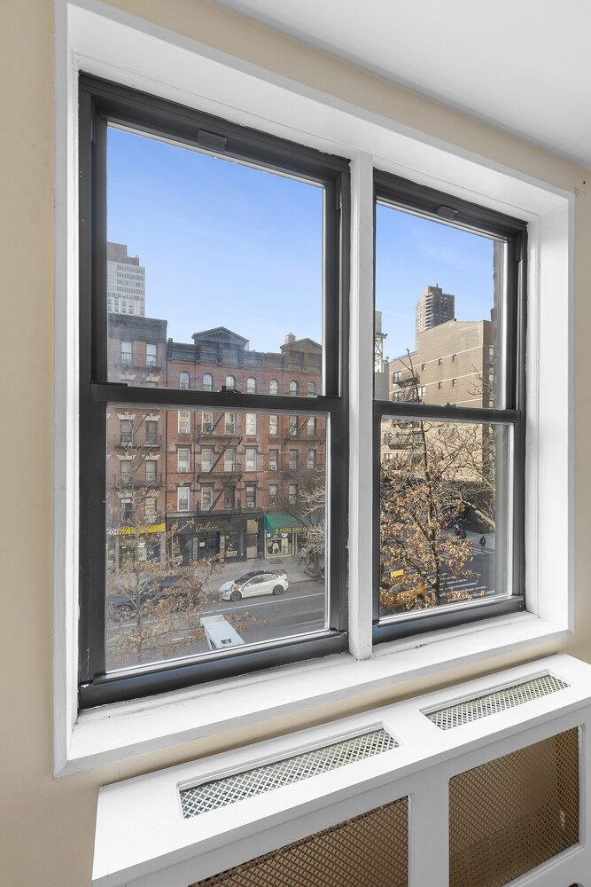 1420 York Avenue, Unit 4B Manhattan, NY 10021 - Photo 2 of 9 a view of a living room and a window