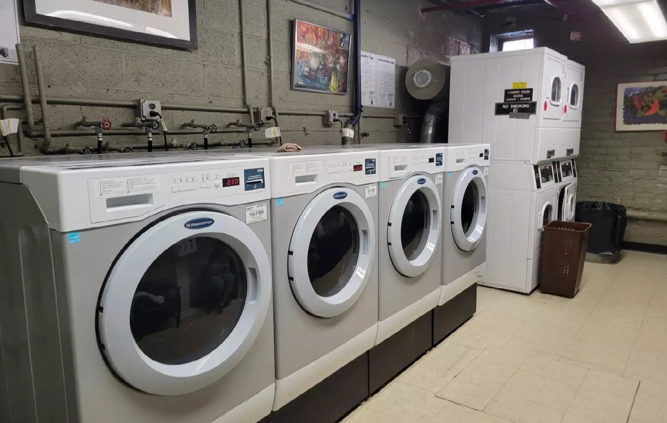 1420 York Avenue, Unit 4B Manhattan, NY 10021 - Photo 5 of 9 a utility room with dryer and washer