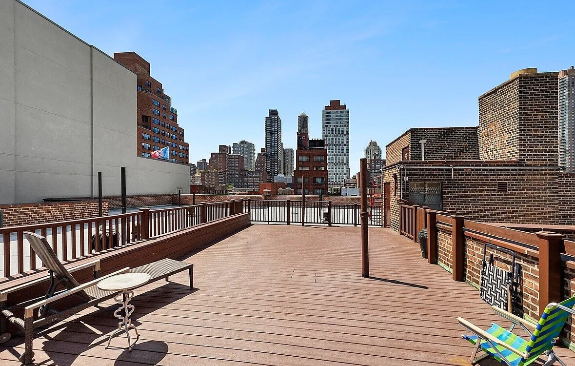 1420 York Avenue, Unit 4B Manhattan, NY 10021 - Photo 6 of 9 a view of roof deck with two chairs and wooden floor