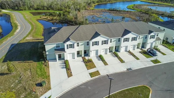 an aerial view of a house with swimming pool