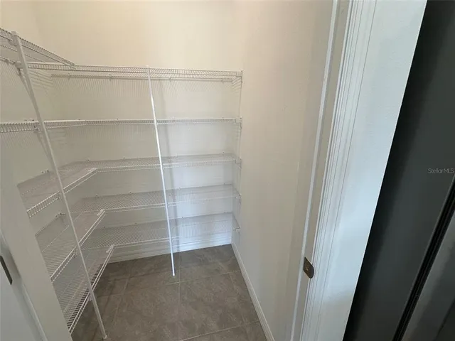 a kitchen that has a sink and a stove top oven