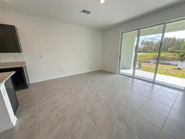 an aerial view of a house with swimming pool and outdoor space