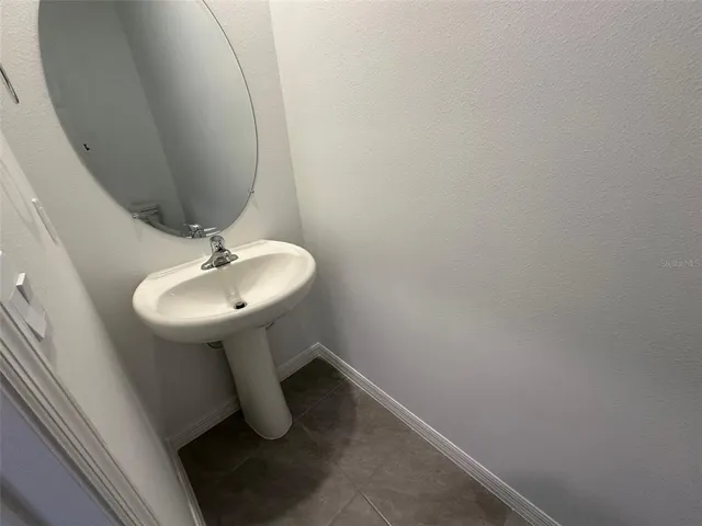 a bathroom with a sink double vanity and a mirror