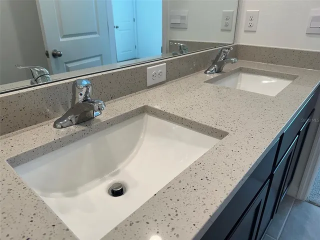 a bathroom with a sink a toilet and bathtub
