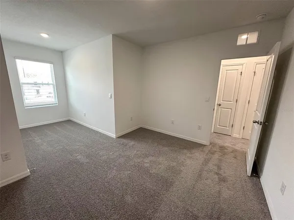 a view of a swimming pool and lounge chairs