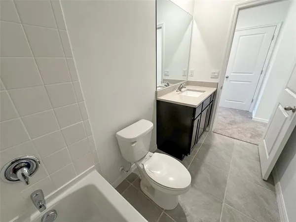 an aerial view of a house with garden space and street view