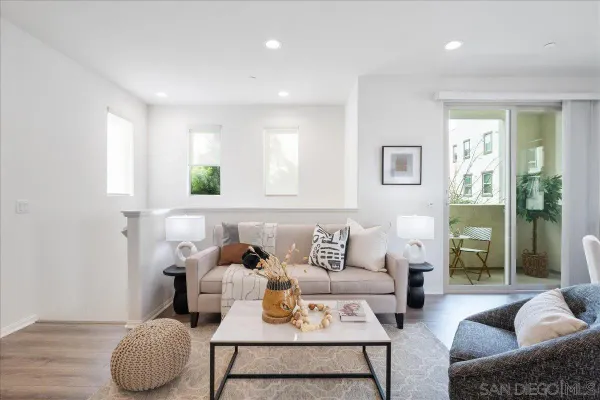 a living room with furniture and a rug