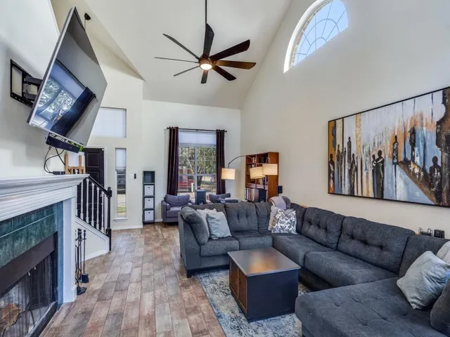 a living room with furniture and a fireplace