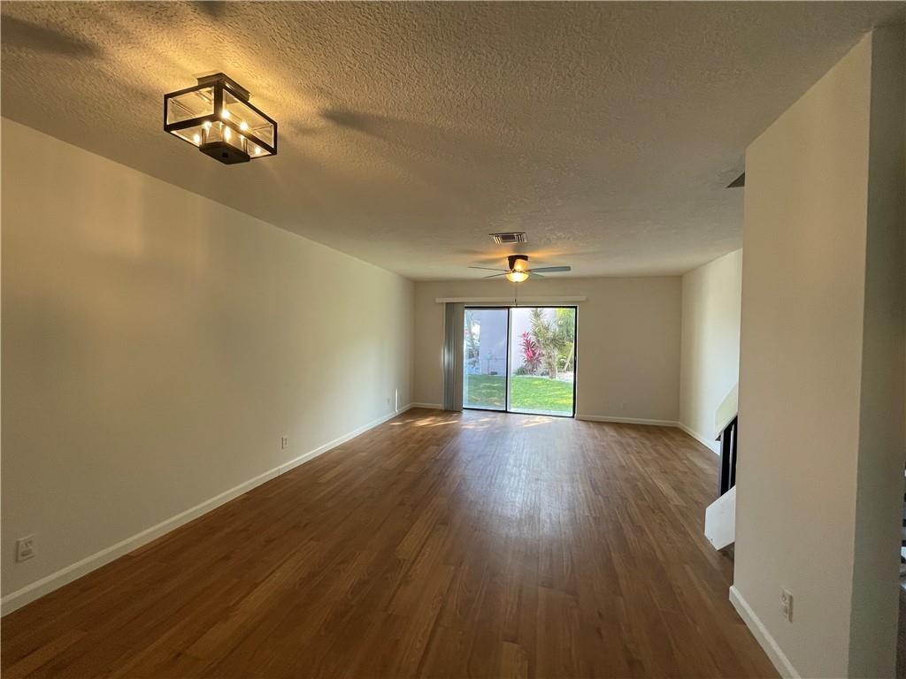 3601 Northeast 22nd Avenue Lighthouse Point, FL 33064 - Photo 4 of 13 an empty room with wooden floor and windows