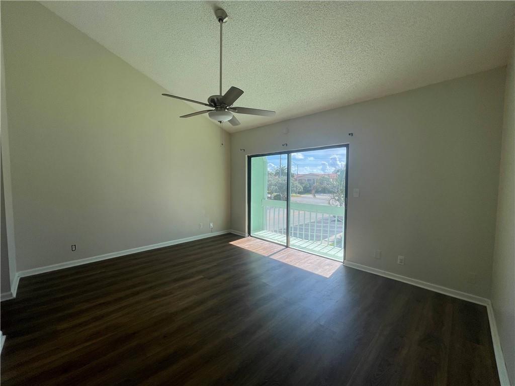 3601 Northeast 22nd Avenue Lighthouse Point, FL 33064 - Photo 8 of 13 a view of an empty room with wooden floor and a window
