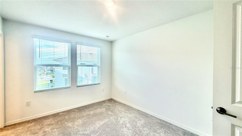 3244 Skyline Loop Kissimmee, FL 34758 - Photo 9 of 13 a view of an empty room with a window