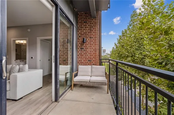 a view of a patio with couches and city view