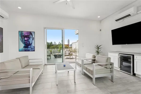 a terrace with outdoor seating and city view