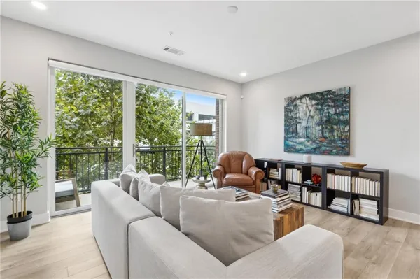 a living room with furniture and a large window