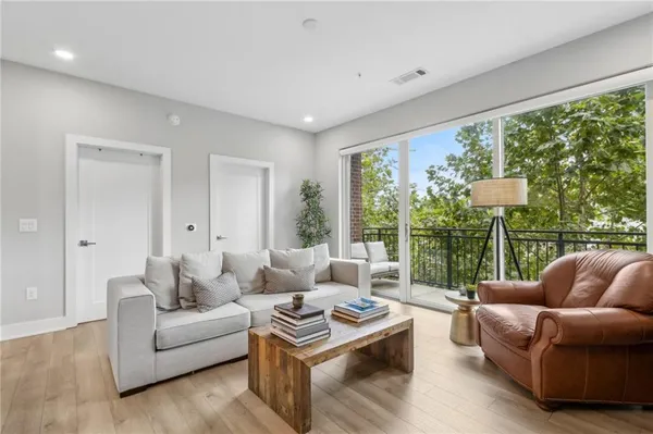 a living room with furniture and a window