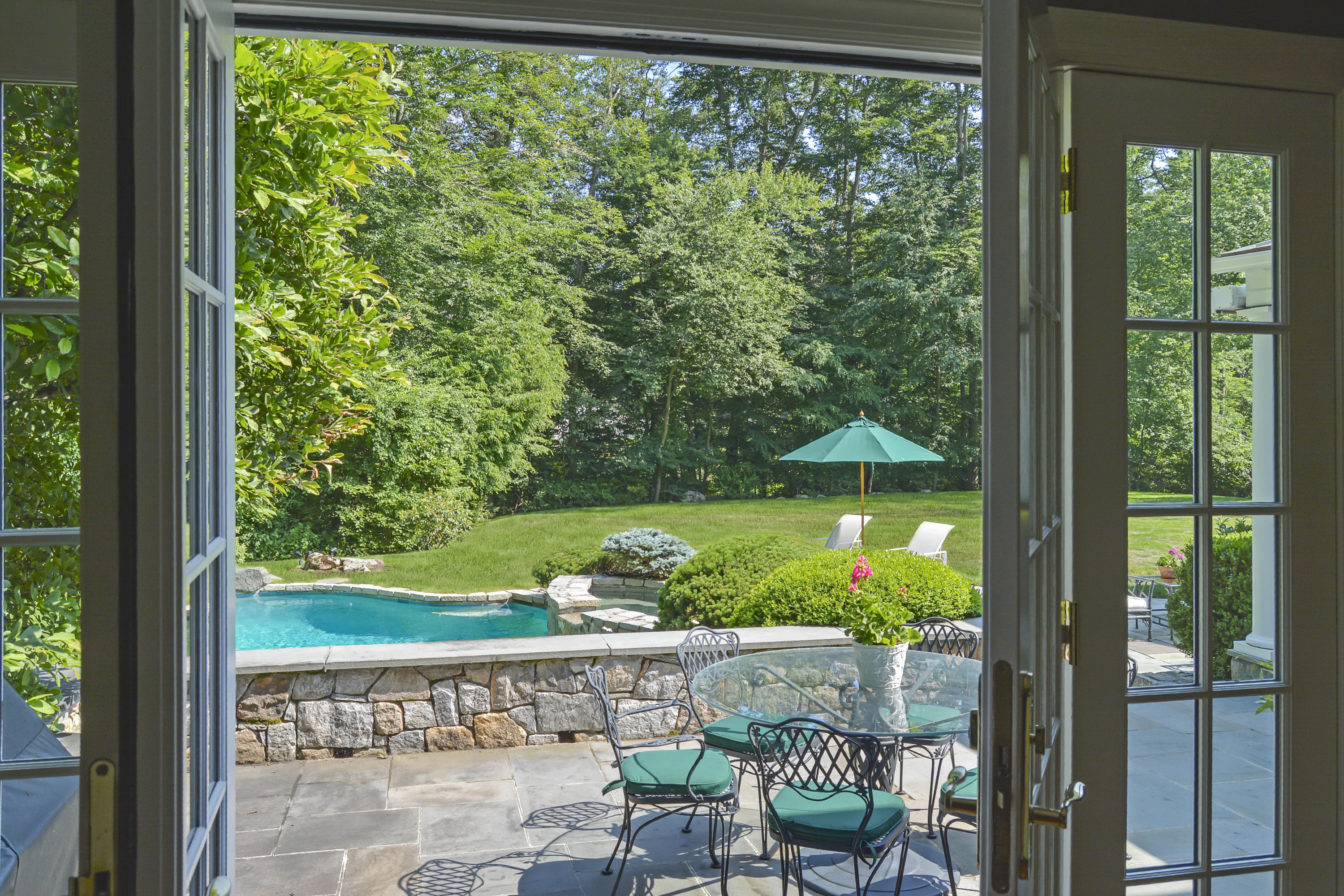 75 Lake Wind Road New Canaan, CT 06840 - Photo 6 of 37 Living room French doors to patio/pool