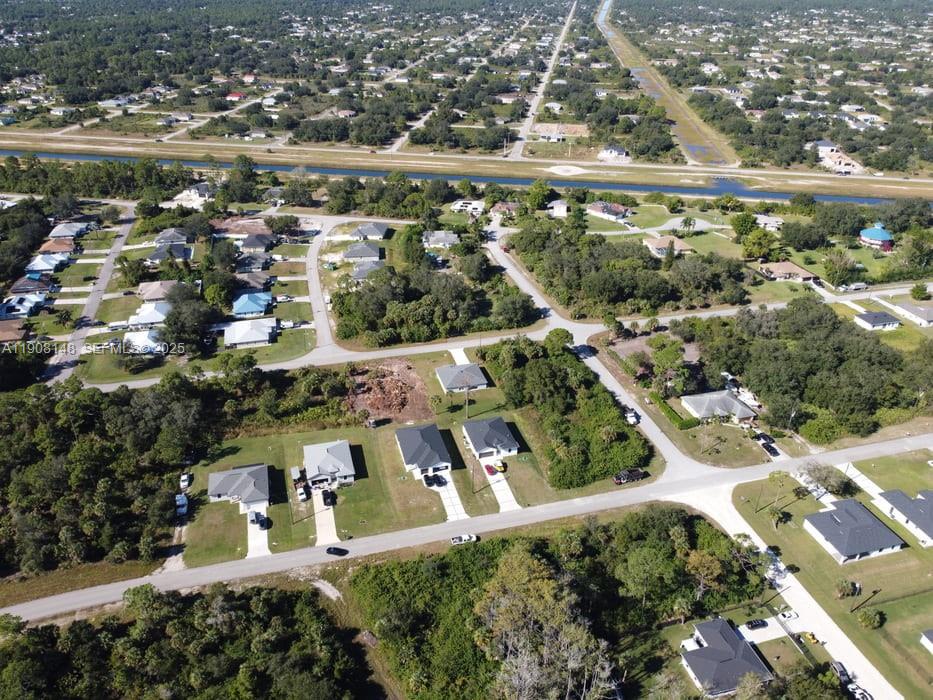 Corner Corner Lehigh Acres, FL 33972 - Photo 7 of 7 an aerial view of residential houses with outdoor space