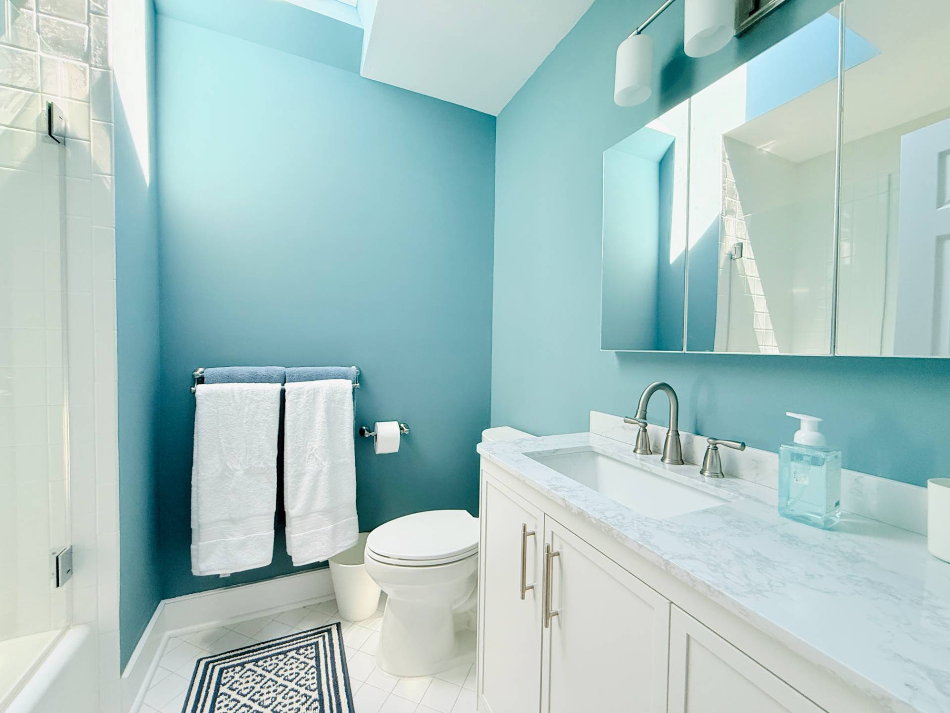 10 Aelfie's Way Bridgehampton, NY 11932 - Photo 28 of 31 a bathroom with a sink a toilet and mirror