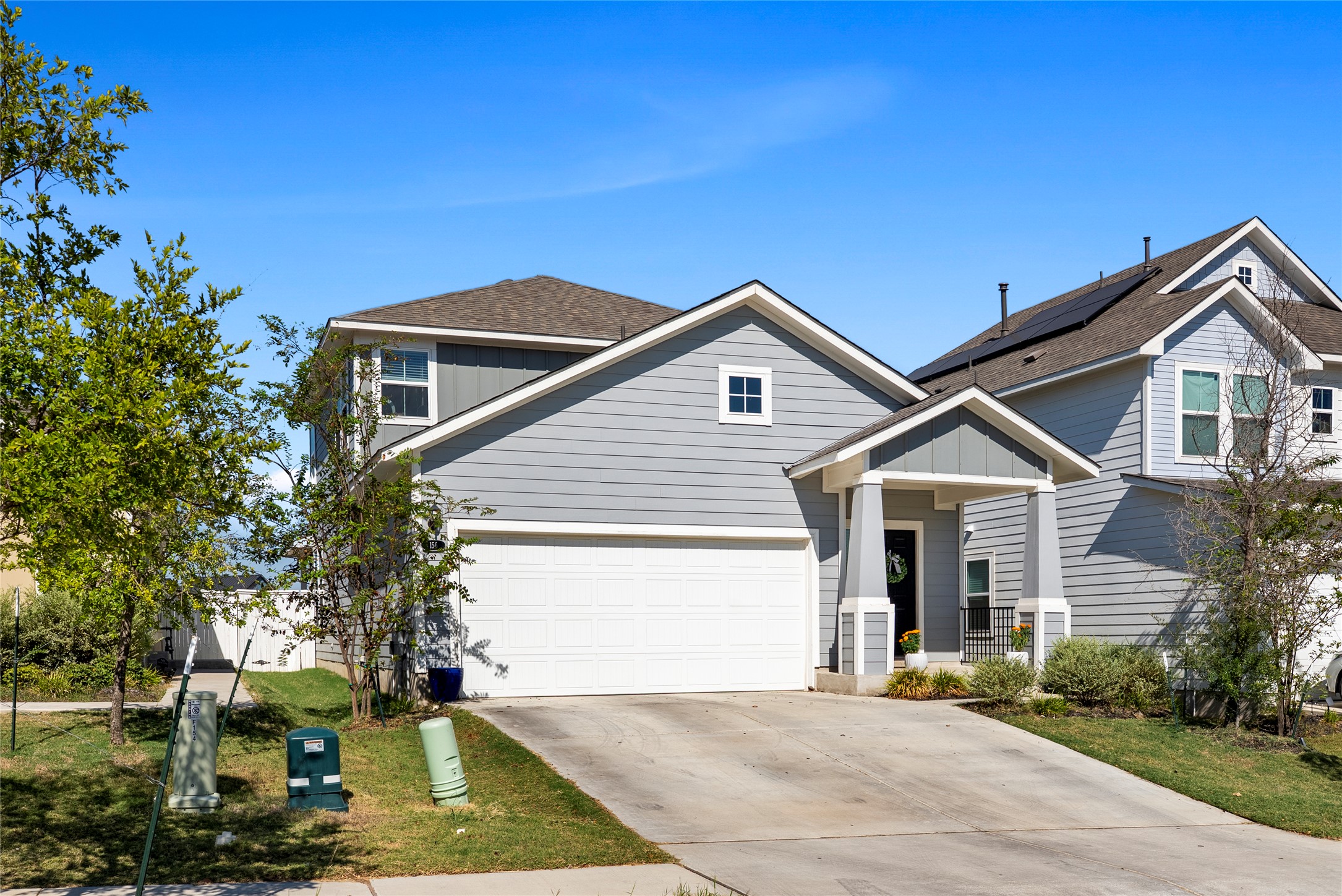 156 Appleberry Lane Elgin, TX 78621 - Photo 1 of 40 a front view of a house with a yard