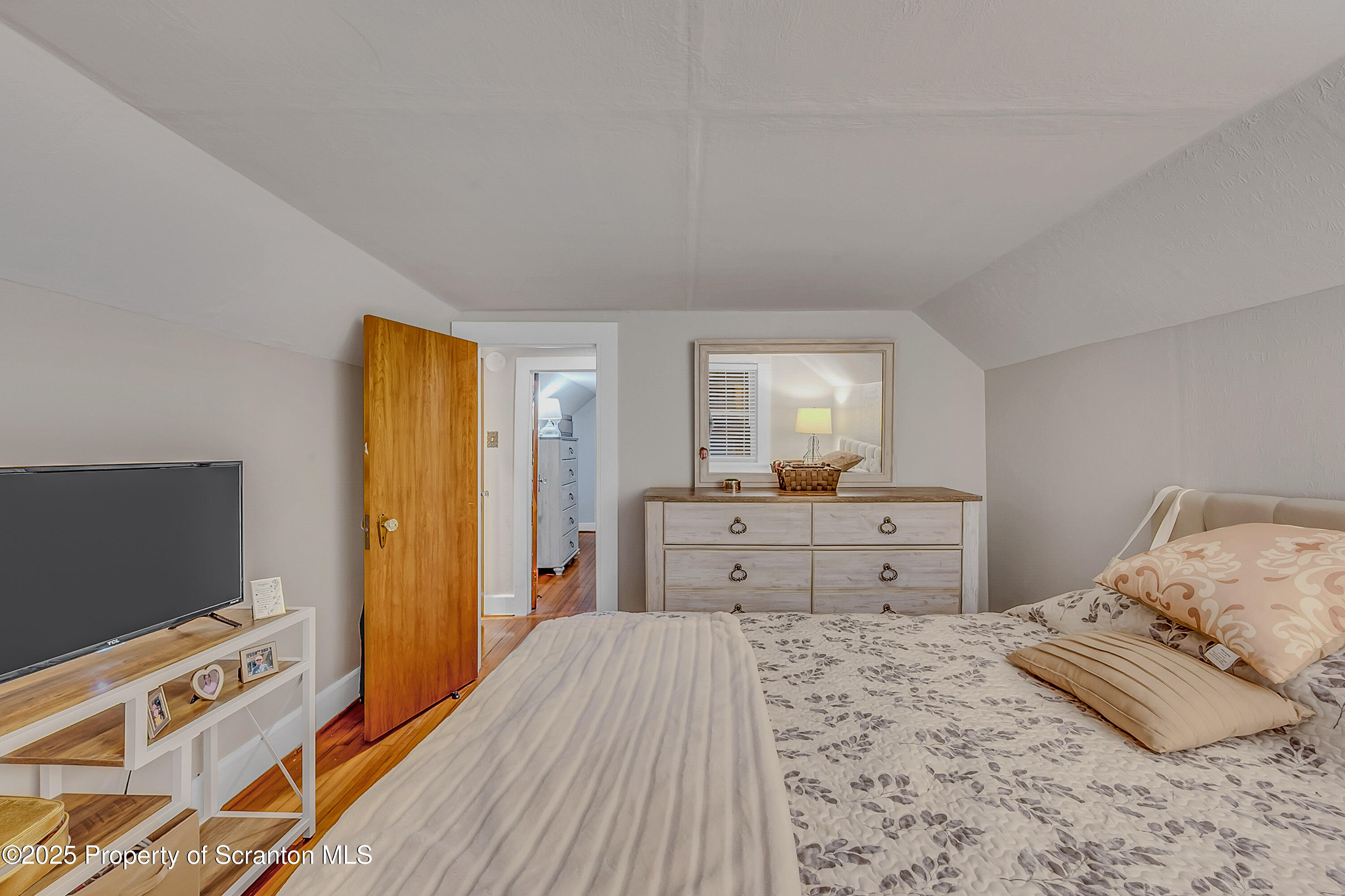 191 Ash Street Archbald, PA 18403 - Photo 15 of 28 a bedroom with a bed and flat screen tv