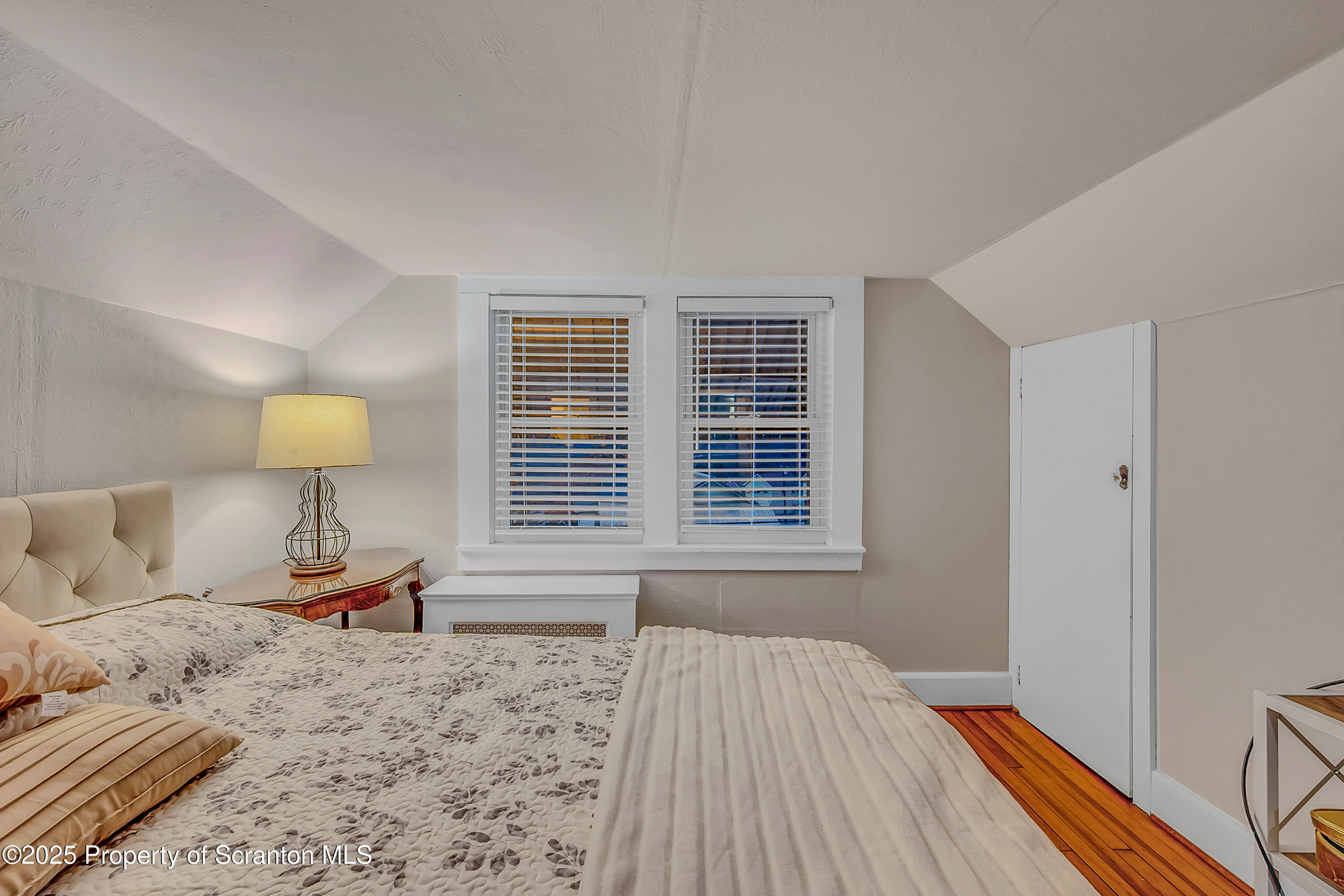 191 Ash Street Archbald, PA 18403 - Photo 16 of 28 a bedroom with a bed and a window